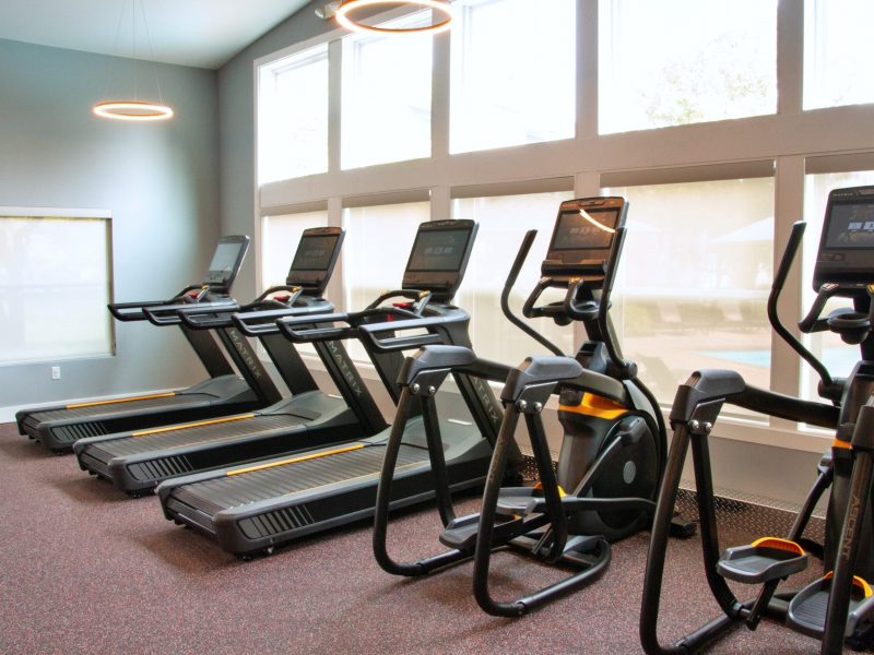 A view of the Athletic Club showing treadmills and stair steppers